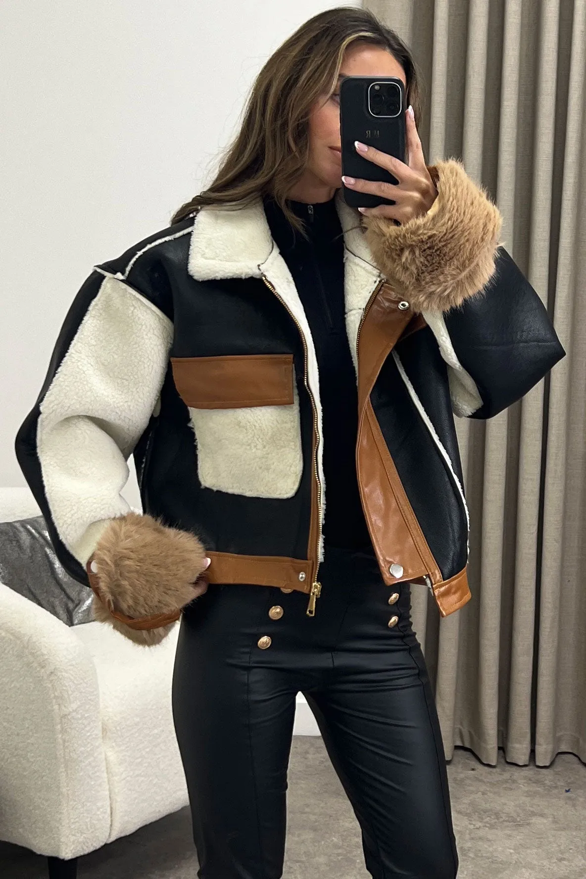 Optimize the e-commerce product title to Stylish Black and Brown Faux Leather Aviator Jacket with Contrasting Shearling Details