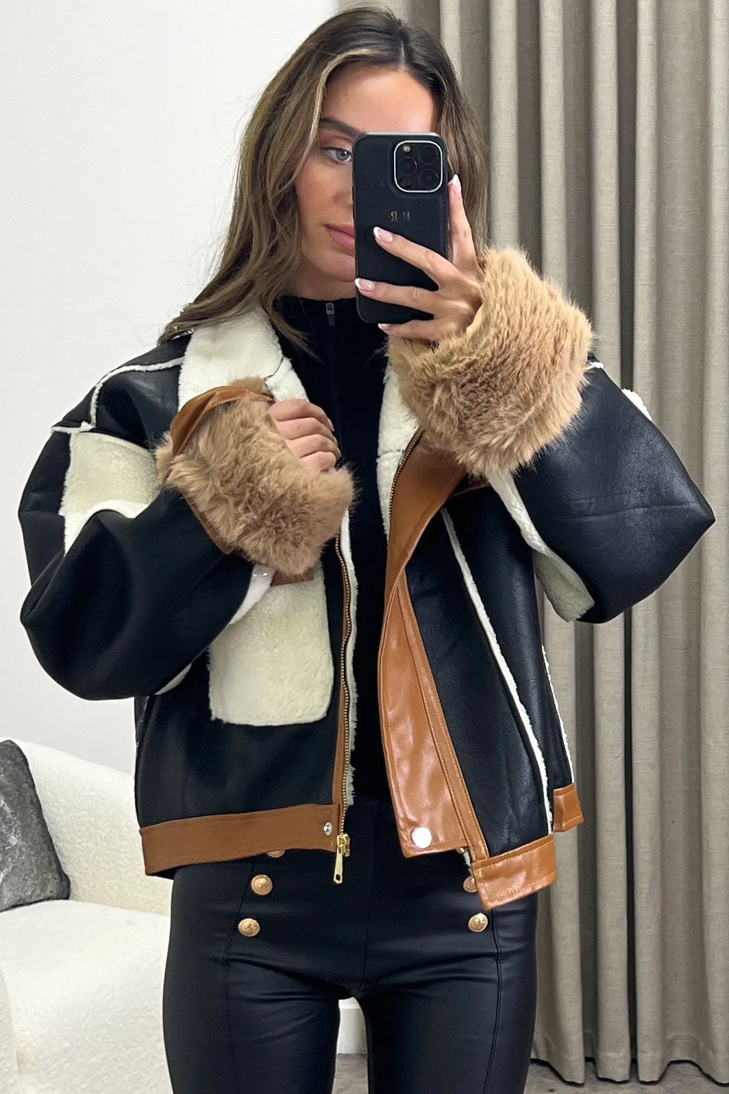 Optimize the e-commerce product title to Stylish Black and Brown Faux Leather Aviator Jacket with Contrasting Shearling Details